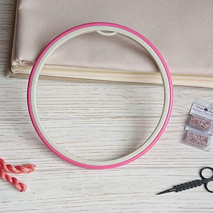 Nurge hoop: plastic with rubbery outer ring.