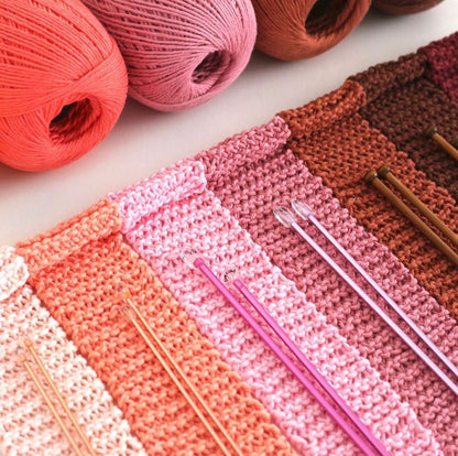 Hand holding Circulo Clea Mercerized Cotton Yarn skein.