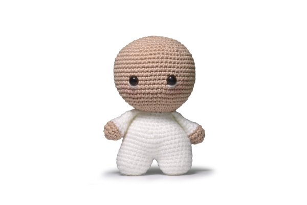 Sheep amigurumi in progress with yarn and hook.