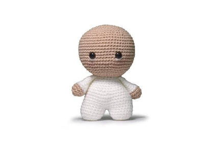 Sheep amigurumi in progress with yarn and hook.